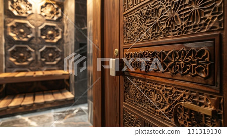 Luxurious bathroom featuring intricate wooden door and wall carvings 131319130
