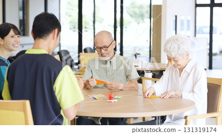 Elderly Asian people folding origami in a care facility 131319174
