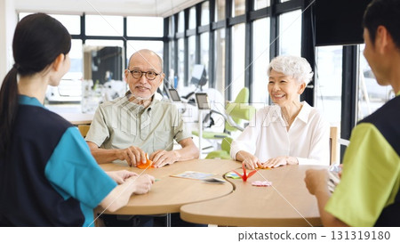 Elderly Asian people folding origami in a care facility 131319180
