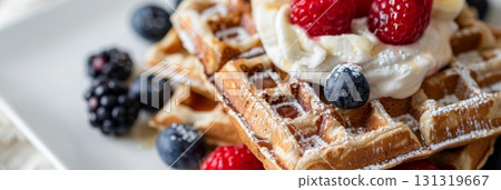A closeup image of a stack of glutenfree buckwheat and banana waffles served with a side of fresh berries and coconut whipped cream a tasty plantbased brunch option 131319667