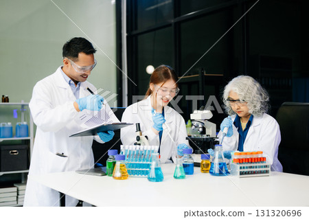Dynamic science lab where a team of scientists collaborates on research, testing, and innovation Dynamic science lab where a team of scientists collaborates on research, testing, and innovation 131320696