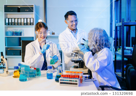 Scientist team meeting and writing analysis results in the laboratory study Scientist team meeting and writing analysis results in the laboratory study 131320698