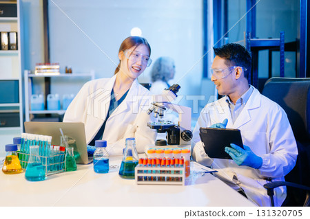 Scientist team meeting and writing analysis results in the laboratory study Scientist team meeting and writing analysis results in the laboratory study 131320705