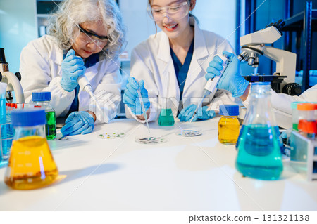 Scientist team with tablet and laptop, laboratory and ecofriendly science. Agriculture, research and scientists 131321138