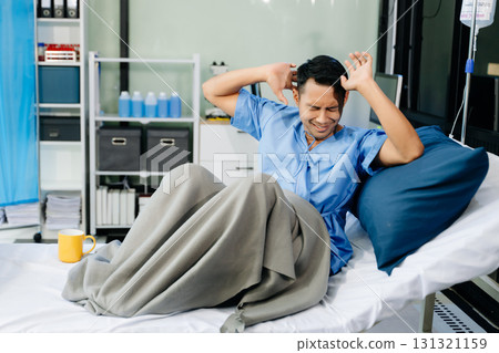 Concerned patient in a hospital bed, capturing emotions tied to medical care, recovery, 131321159