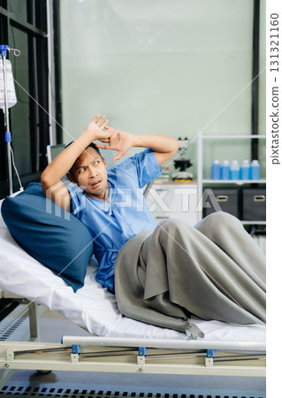 Concerned patient in a hospital bed, capturing emotions tied to medical care, recovery, 131321160