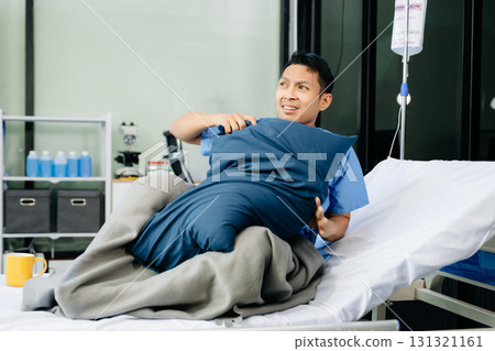 Concerned patient in a hospital bed, capturing emotions tied to medical care, recovery, 131321161