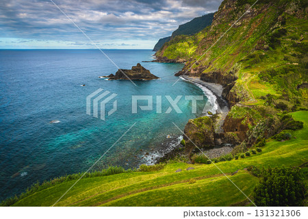 Admirable seaside view with colorful rocks and green steep slopes 131321306