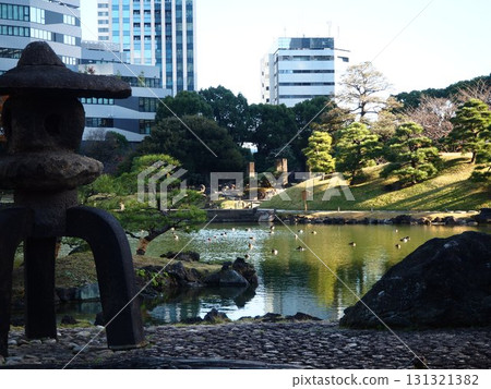 The large pond where waterfowl rest in the Kyu-Shiba Rikyu Gardens in late autumn The large pond where waterfowl rest in the Kyu-Shiba Rikyu Gardens in late autumn 131321382