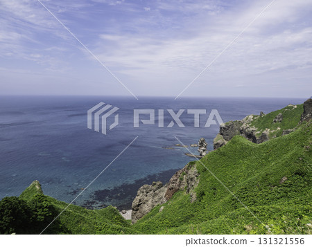 A beautiful sculpture jutting out into the sea A beautiful sculpture jutting out into the sea 131321556