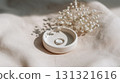 Romantic wedding concept with a delicate diamond ring in sunlight 131321616