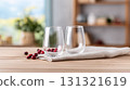 Two empty glasses with fresh cranberries in a bright kitchen 131321619