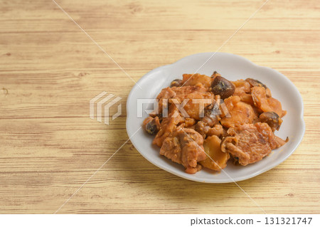 Stir-fried pork, potatoes and mushrooms with miso 131321747