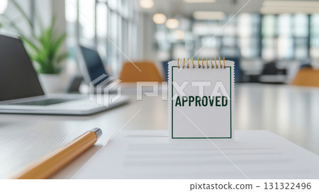 Approved note on desk in modern office, symbolizing success and achievement 131322496