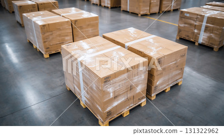 Neatly stacked cardboard boxes on pallets in distribution center 131322962