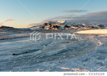 Winter scenery of the Snaefellsnes Peninsula: Snowy mountains and fishing villages, a spectacular view of Iceland 131325220