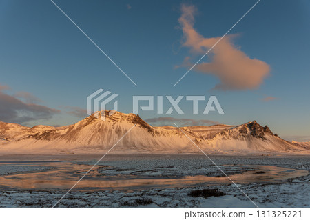 Winter scenery of the Snaefellsnes Peninsula: Snowy mountains and fishing villages, a spectacular view of Iceland 131325221