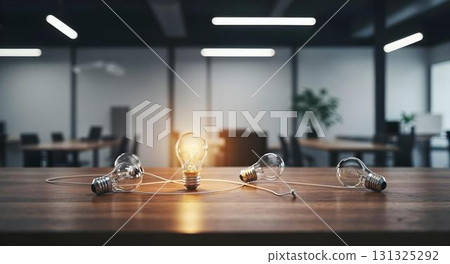 A table filled with light bulbs, highlighting the theme of ideas and success in a collaborative office setting 131325292