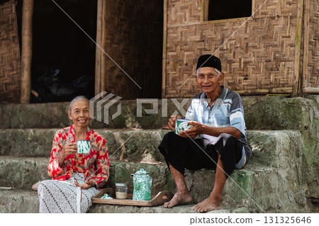 Cultural Harmony An Elderly Couple Enjoying Tea Together in a Traditional Setting 131325646