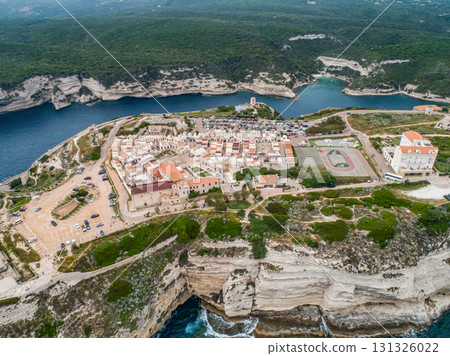 Aerial view marina cape Bonifacio south Corsica France citadel on rocky promontory on wild white limestone cliffs 131326022