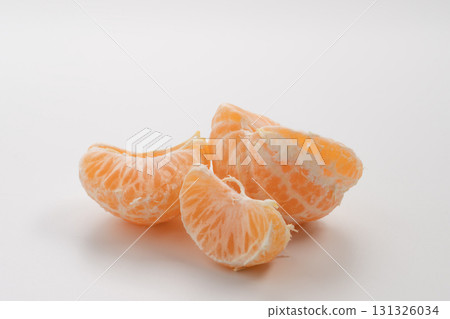 Half of peeled tangerine or mandarin fruit on white background isolated 131326034