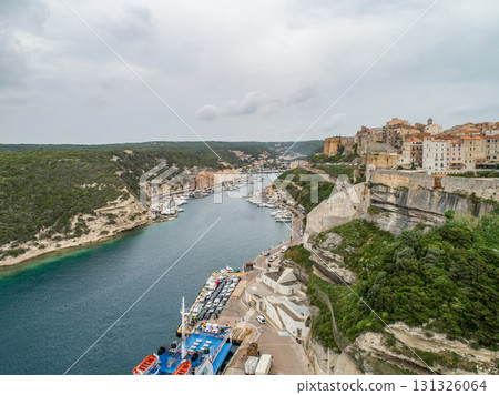 Aerial view marina cape Bonifacio south Corsica France citadel on rocky promontory on wild white limestone cliffs Aerial view marina cape Bonifacio south Corsica France citadel on rocky promontory on wild white limestone cliffs 131326064