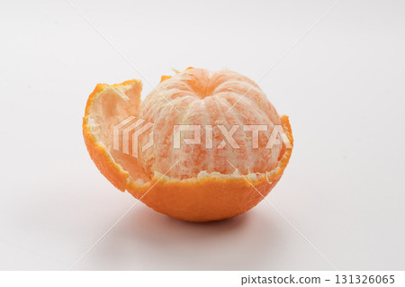 Peeled tangerine or mandarin fruit on white background isolated Peeled tangerine or mandarin fruit on white background isolated 131326065