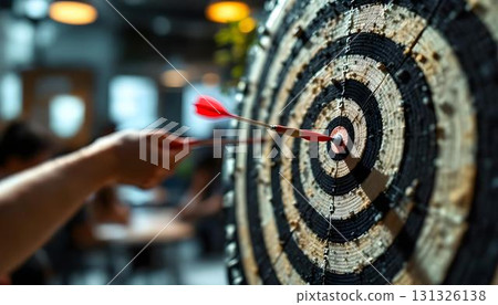 A dart embedded in a dartboard symbolizes achievement and strategy in problem-solving contexts A dart embedded in a dartboard symbolizes achievement and strategy in problem-solving contexts 131326138