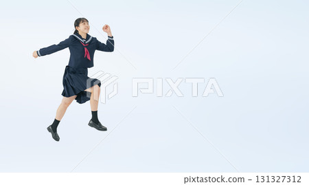 A full-body photo of a jumping female student wearing a sailor suit 131327312