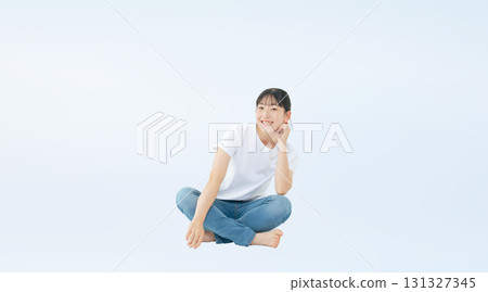 Full-body photo of a smiling teenage girl wearing casual clothing Full-body photo of a smiling teenage girl wearing casual clothing 131327345