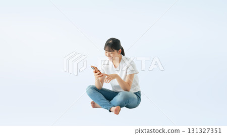 Full-body photo of a smiling teenage girl wearing casual clothing 131327351