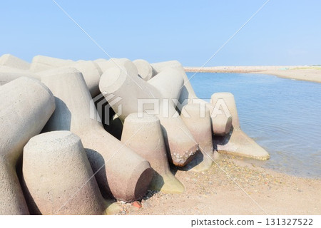 Tetrapods and breakwaters line the sea at Fujie Coast 131327522