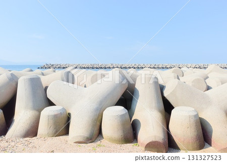 Tetrapods and breakwaters line the sea at Fujie Coast 131327523