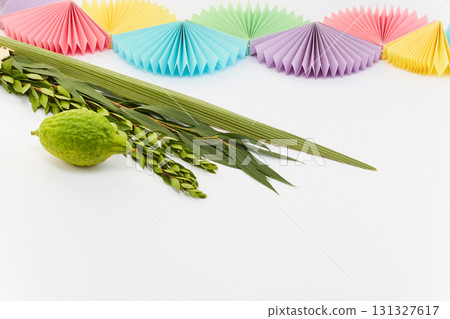 Sukkot Celebration Setup. A vibrant Sukkot setup featuring a lulav, etrog 131327617