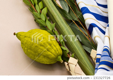 Traditional Sukkot Arrangement. A close-up of Sukkot symbols including an etrog, lulav Traditional Sukkot Arrangement. A close-up of Sukkot symbols including an etrog, lulav 131327726