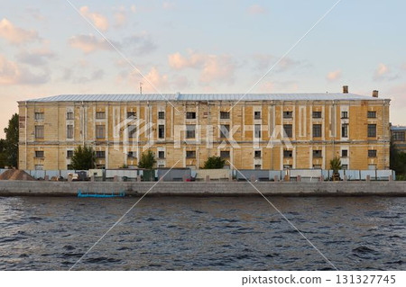 This is a Historical Building that gracefully stands by the Waters edge near the river 131327745