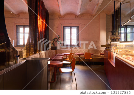 The Contemporary Cafe Interior Features Warm Lighting That Creates a Cozy and Inviting Ambiance 131327885