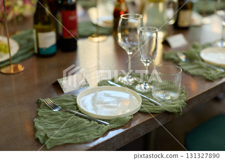 An Elegant Table Setting Designed for a Sophisticated and Upscale Dinner Event Experience 131327890