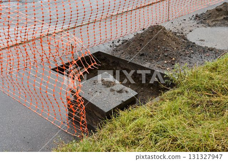 Construction Site with Safety Barriers, Excavation Work, and Ongoing Development Activities 131327947