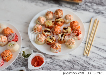 An Exquisite and Colorful Sushi Platter Featuring a Variety of Delicious Sushi Options 131327973