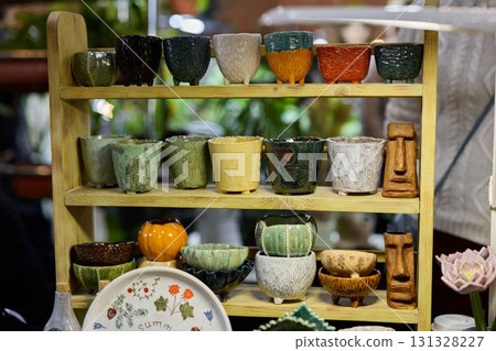 A Beautiful Collection of Artful Ceramic Pots Displayed Elegantly for All to Admire A Beautiful Collection of Artful Ceramic Pots Displayed Elegantly for All to Admire 131328227