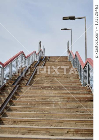 Beautiful Wooden Steps Leading Upwards, Complete with Railings and Street Lights Lighting the Way 131328463