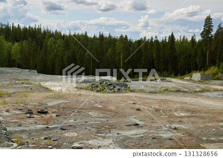 An Abandoned Quarry That is Surrounded by a Beautiful and Lush Green Forest Landscape An Abandoned Quarry That is Surrounded by a Beautiful and Lush Green Forest Landscape 131328656