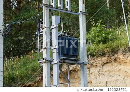 Installing power transformers is vital for ensuring a reliable electricity supply in nature Installing power transformers is vital for ensuring a reliable electricity supply in nature 131328751