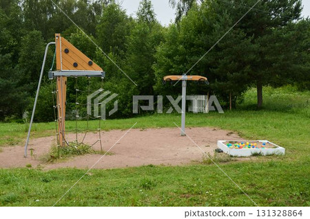 Enjoying Playground Equipment in a Beautiful Natural Setting Enhances Every Childs Experience Enjoying Playground Equipment in a Beautiful Natural Setting Enhances Every Childs Experience 131328864