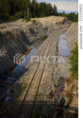 An Abandoned Railway Track that is Beautifully Surrounded by Natures Intense Beauty 131328952