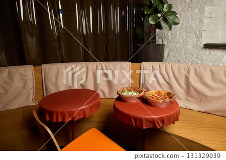 Experience a Cozy and Inviting Dining Area with Snack Bowls in a Modern Restaurant Setting 131329039