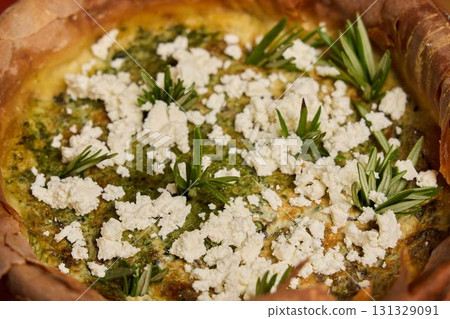 Enjoy a tasty Herb and Cheese Tart paired with Fresh Greens for a delightful experience Enjoy a tasty Herb and Cheese Tart paired with Fresh Greens for a delightful experience 131329091