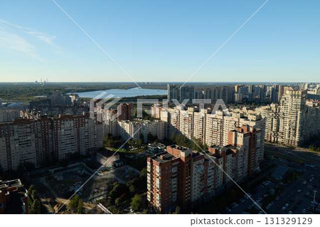An Aerial View showcasing the Urban Landscape including a River and Various Residential Buildings An Aerial View showcasing the Urban Landscape including a River and Various Residential Buildings 131329129