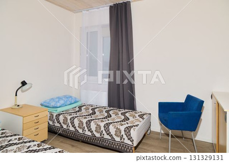 A Cozy Bedroom Featuring Elegant Decor, Beautiful Natural Light, and an Inviting Atmosphere 131329131